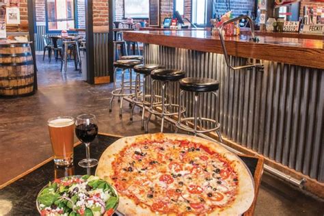 Pinky g's pizzeria - Pinky G's gets its name from a location below the Pink Garter Theater, a concert and live performance venue. It was originally just one room with a pizza counter and ovens, like the New York-style ...